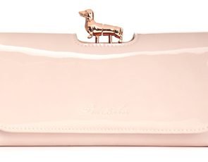 Ted Baker pale pink patent leather purse featuring a gold dachshund bobble clasp for stylish dog mums.