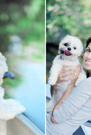 Smiling dog mum holding her fluffy white pup outdoors, celebrating a fun pet-friendly holiday.
