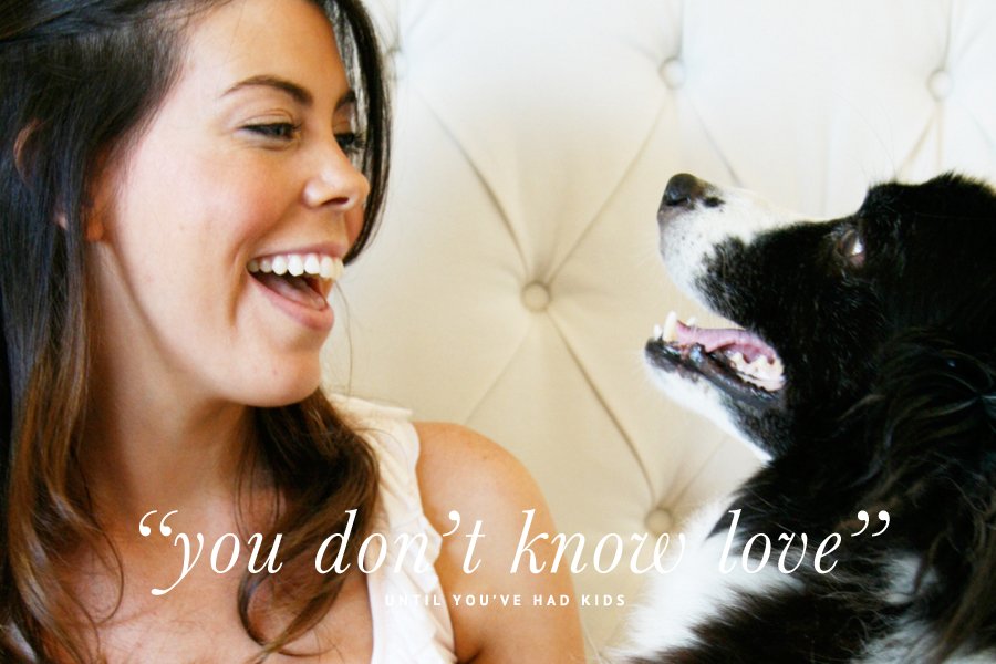 Smiling woman looking at her dog with overlay text: "you don't know love" until you've had kids.
