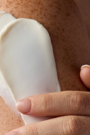 Applying smooth, cruelty-free skincare cream to skin, promoting a natural and cruelty-free lifestyle for dog mums.