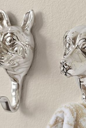 Stylish silver dog head wall hooks hanging a towel, featured in our curated dog product shopping guides.