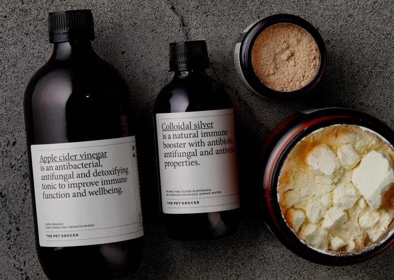 Natural dog hot spot home remedies including apple cider vinegar, colloidal silver, and powders from The Pet Grocer.