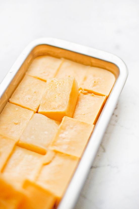 Frozen square grain-free dog treats in a metal tray, a healthy DIY recipe for dogs.