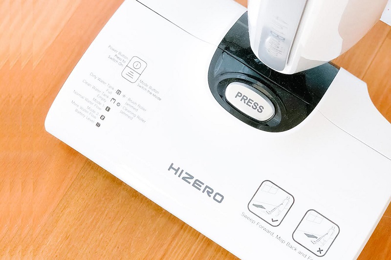 HIZERO All-in-One Floor Cleaner control panel and status indicators on a wood floor for dog owners.